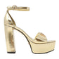 GUESS SANDALI CON TACCO PLATEAUX ORO