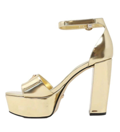 GUESS SANDALI CON TACCO PLATEAUX ORO